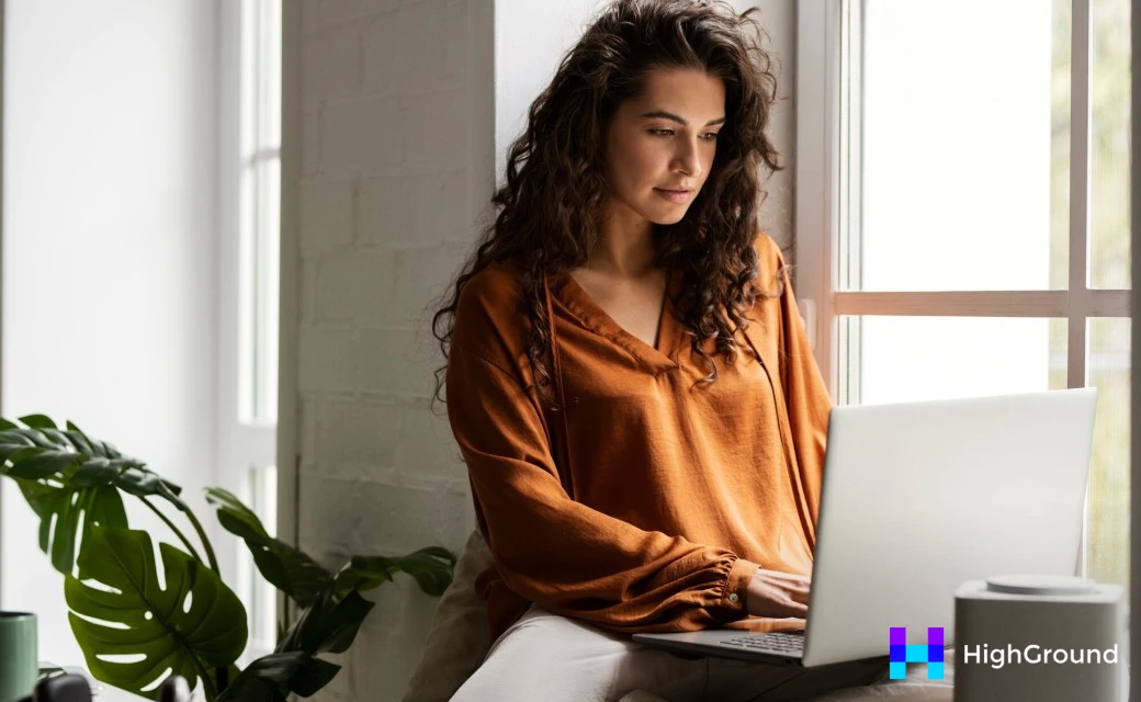 Medium shot woman working on laptop